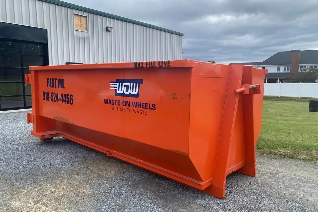 Waste On Wheels roll-off dumpster staged at a commercial job site in Wake County, NC