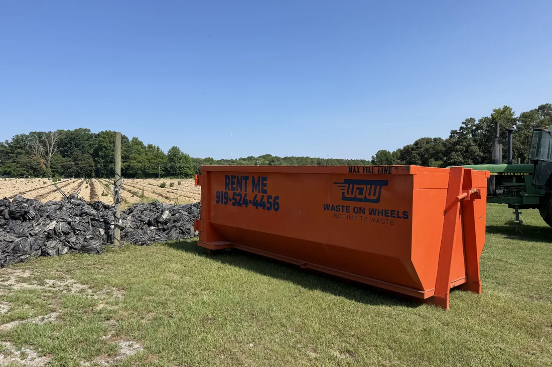 Waste On Wheels roll-off dumpster on a job in Dunn, Harnett County, NC