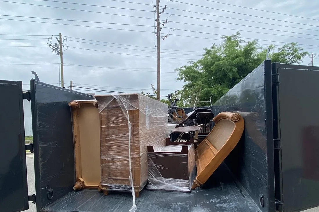 Loaded Waste On Wheels dumpster on a junk removal job near Willow Spring, NC