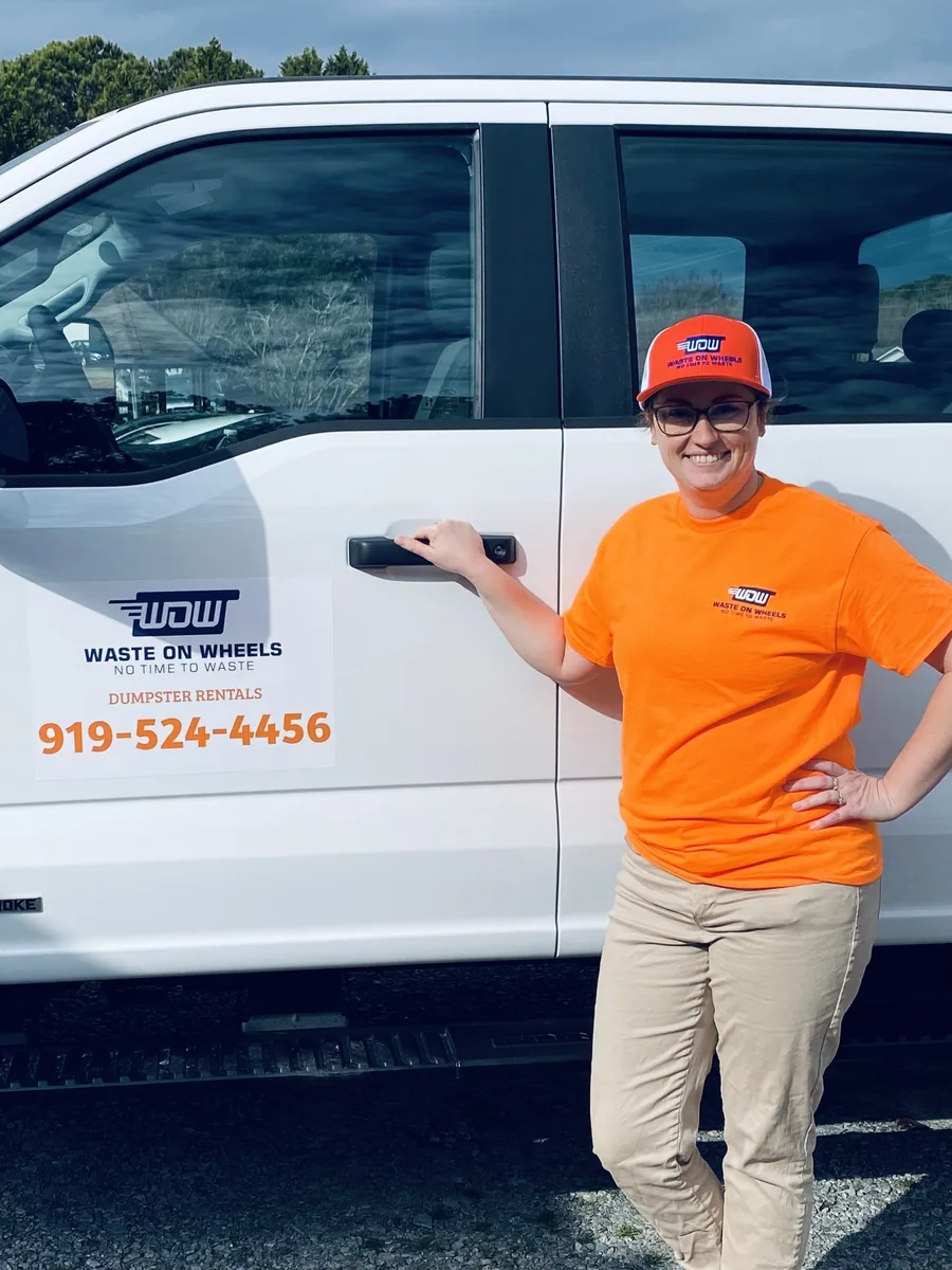 Logan of Waste On Wheels with the roll-off truck in Willow Spring, NC